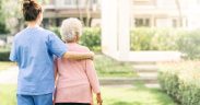 Image of a luxury old age home showing a female nurse with a female retiree