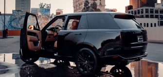 image showing a luxury range rover in a city parking lot