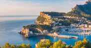 View overlooking a bay in mallorca and a hillside lined with villas and apartments