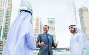 Image showing 3 men talking in Dubai