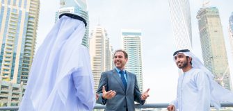 Image showing 3 men talking in Dubai