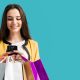 woman holding shopping bags while shopping using high end luxury shopping apps